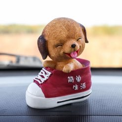 Игрушка на панель автомобиля «Собака качающая головой в ботинке»